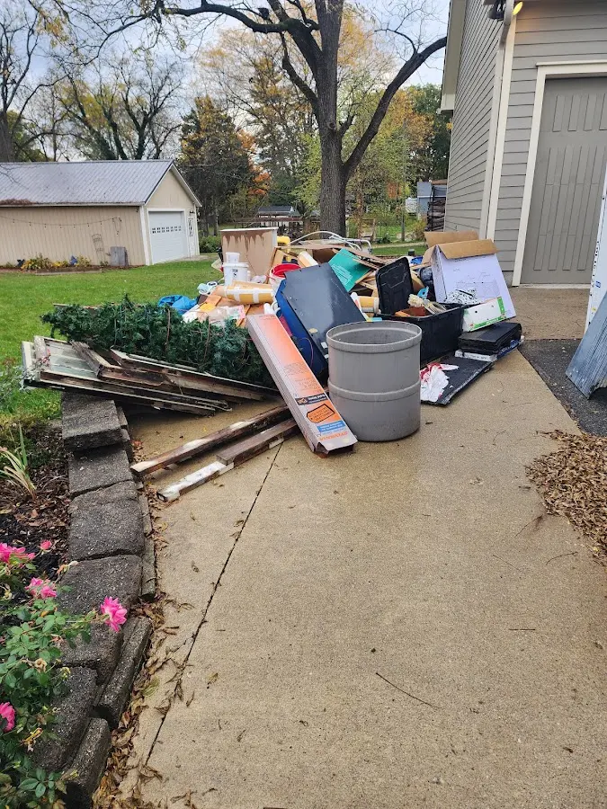 Dumpster being loaded with debris for Demolition Dumpster Rental in North Logan